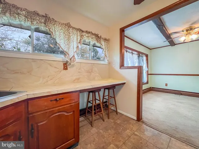 a view of a livingroom with furniture and window