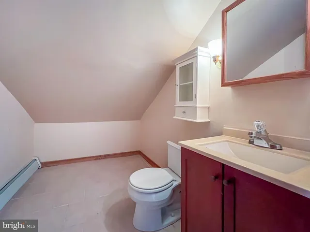 a bathroom with a sink a toilet and vanity