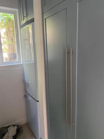 a bathroom with a glass door shower and a sink