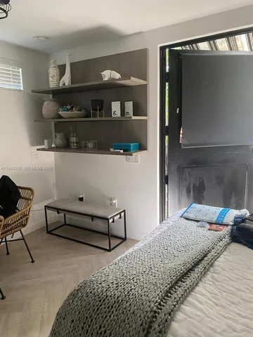 a bedroom with a bed and a cabinets