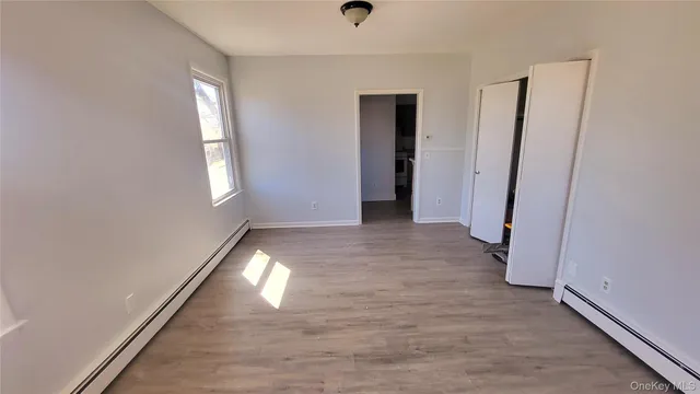 a view of entryway with wooden floor
