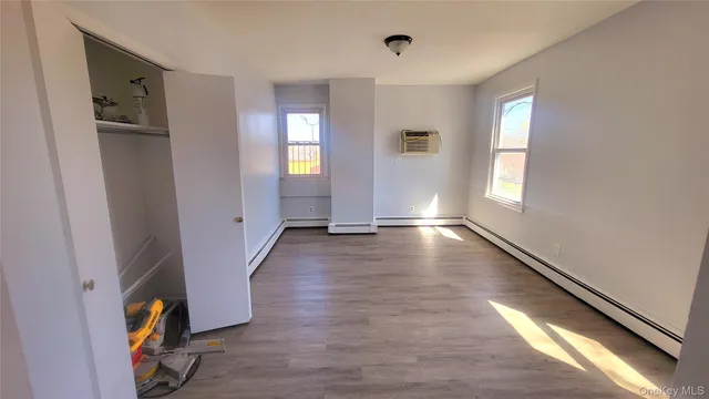 a view of gallery with wooden floor