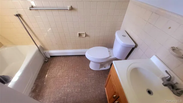 a bathroom with a sink and toilet
