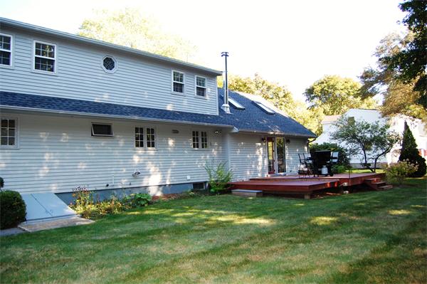 8 Scenna Road Beverly, MA 01915 - Photo 14 of 17 a front view of a house with a garden