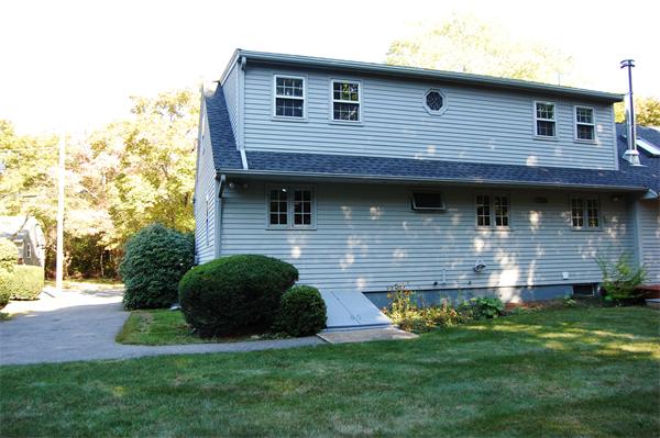 8 Scenna Road Beverly, MA 01915 - Photo 15 of 17 a view of a house next to a yard