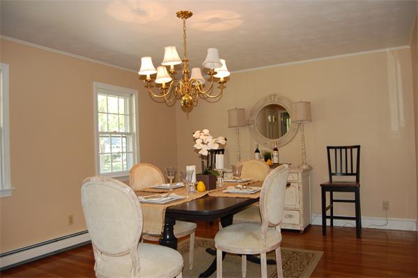 8 Scenna Road Beverly, MA 01915 - Photo 6 of 17 a dining room with chandelier fan and wooden floor