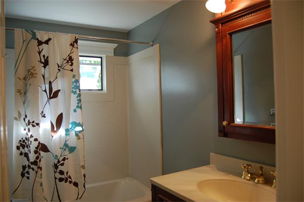 8 Scenna Road Beverly, MA 01915 - Photo 8 of 17 a bathroom with a sink and mirror with toilet