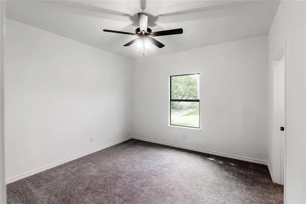 a kitchen with stainless steel appliances granite countertop a sink a stove and a microwave