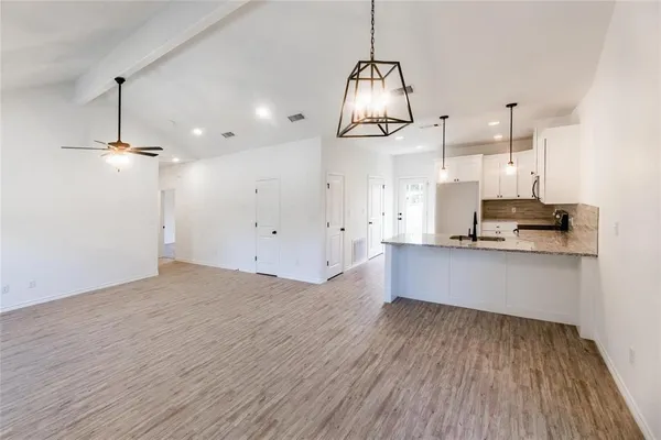 a view of backyard and tree