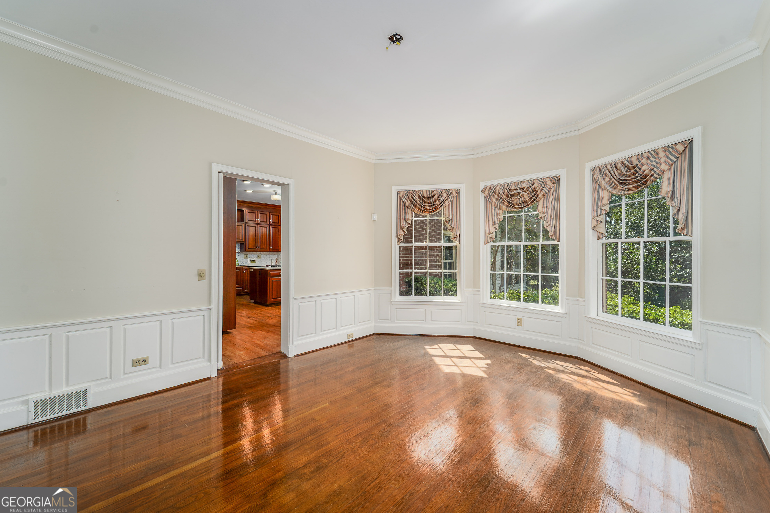 1602 Ward St Extension West Douglas, GA 31533 - Photo 20 of 70 a view of an empty room with wooden floor and a window