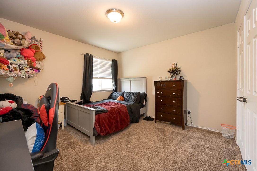 2511 Pintail Loop Copperas Cove, TX 76522 - Photo 19 of 26 a bed room with a bed and a dresser