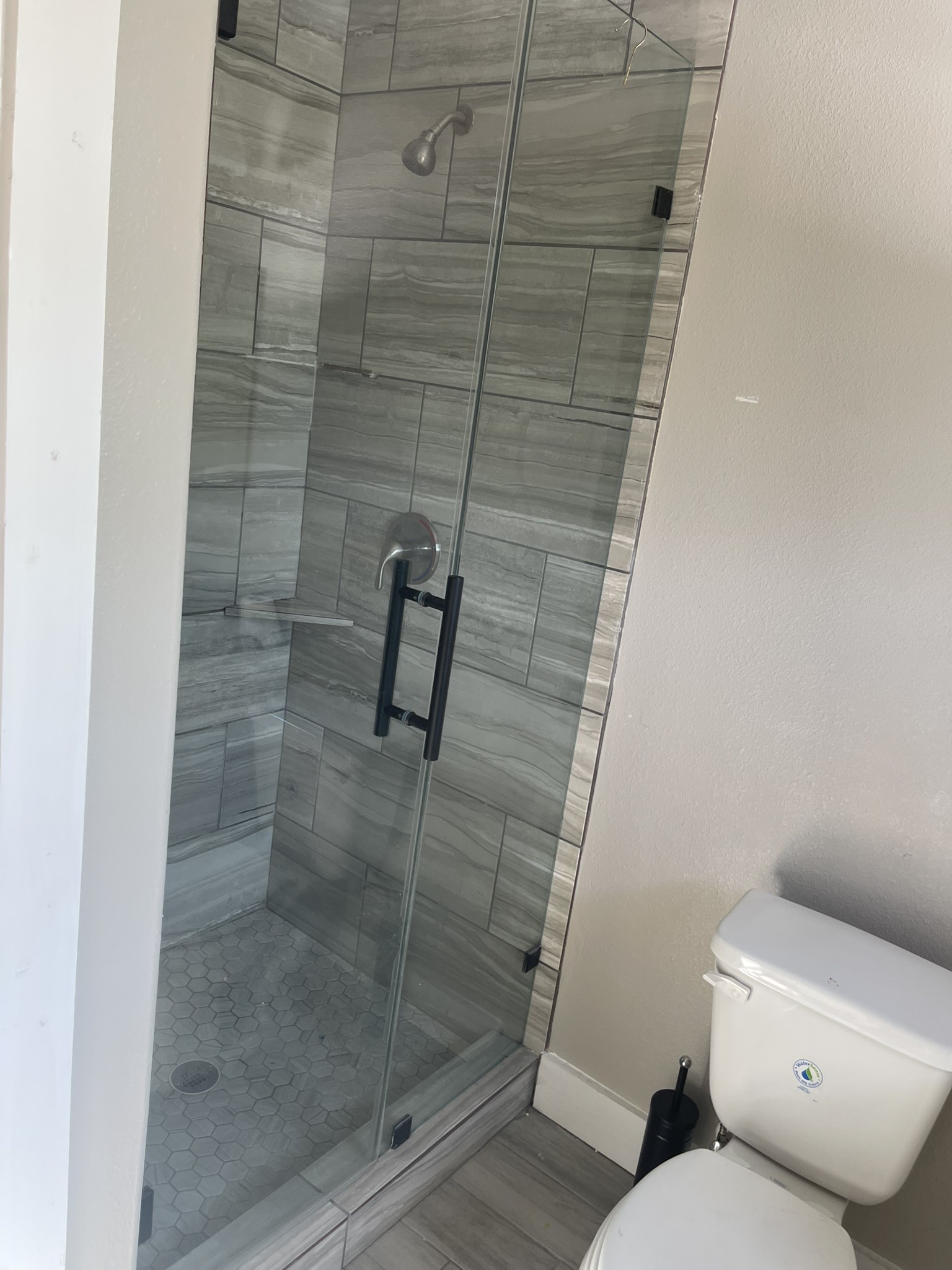 5829 Hartwick Road Houston, TX 77016 - Photo 11 of 47 a bathroom with a shower and toilet