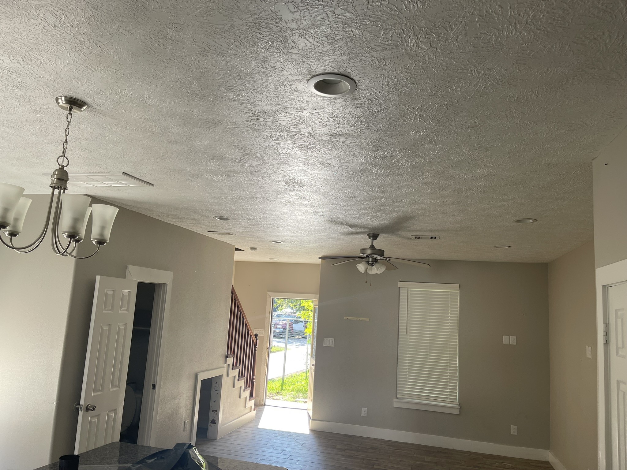 5829 Hartwick Road Houston, TX 77016 - Photo 14 of 47 a view of a room with wooden floor and staircase