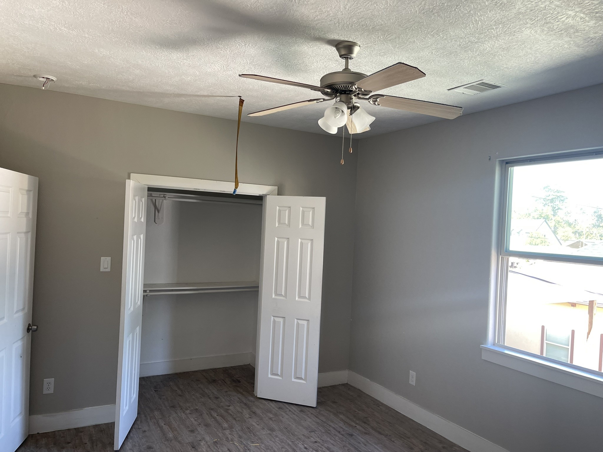 5829 Hartwick Road Houston, TX 77016 - Photo 16 of 47 a view of an empty room with a window