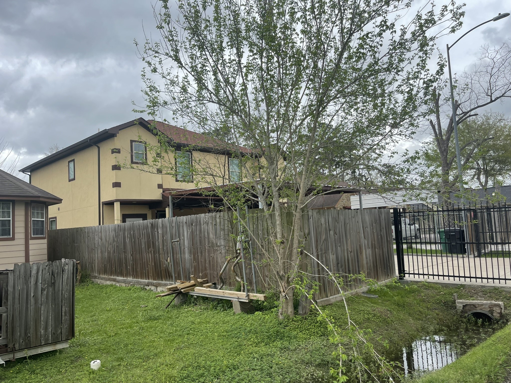 5829 Hartwick Road Houston, TX 77016 - Photo 2 of 47 a front view of a house with a garden