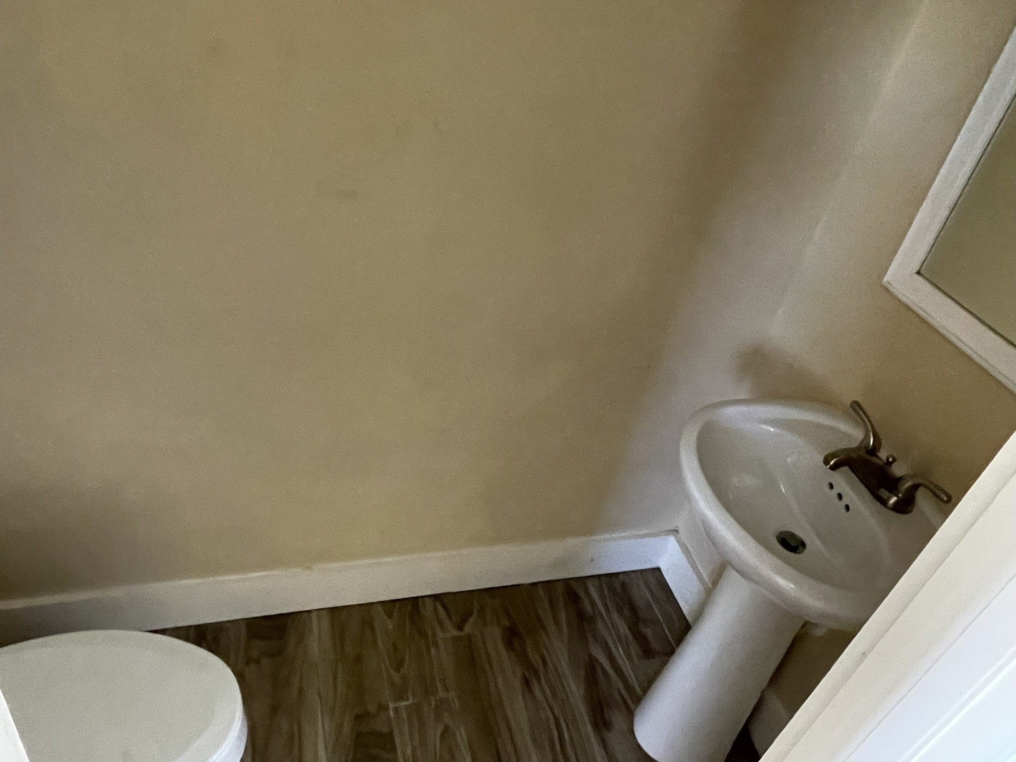 5829 Hartwick Road Houston, TX 77016 - Photo 22 of 47 a bathroom with a toilet and a sink