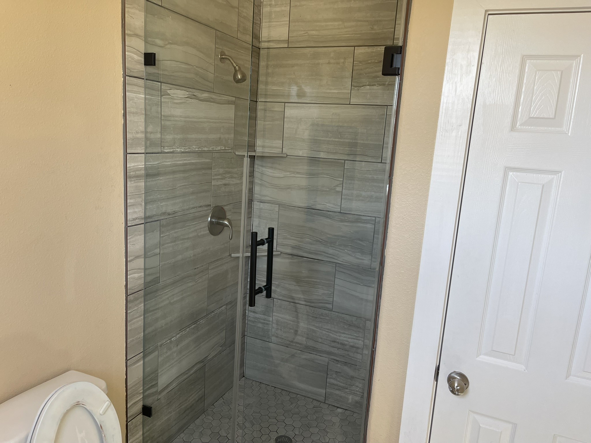 5829 Hartwick Road Houston, TX 77016 - Photo 26 of 47 a bathroom with a shower and toilet