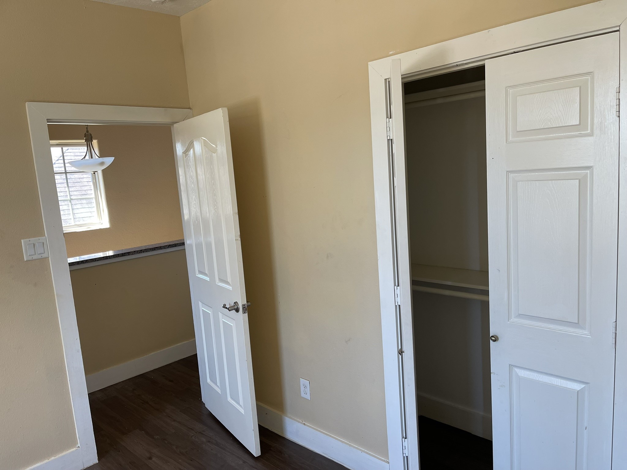 5829 Hartwick Road Houston, TX 77016 - Photo 27 of 47 an entryway with wooden floor and a hallway