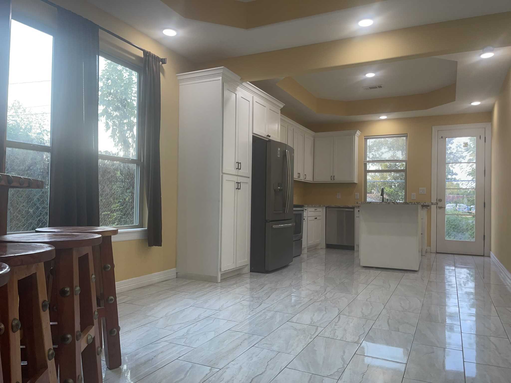 5829 Hartwick Road Houston, TX 77016 - Photo 32 of 47 a kitchen with stainless steel appliances granite countertop a refrigerator and a stove top oven