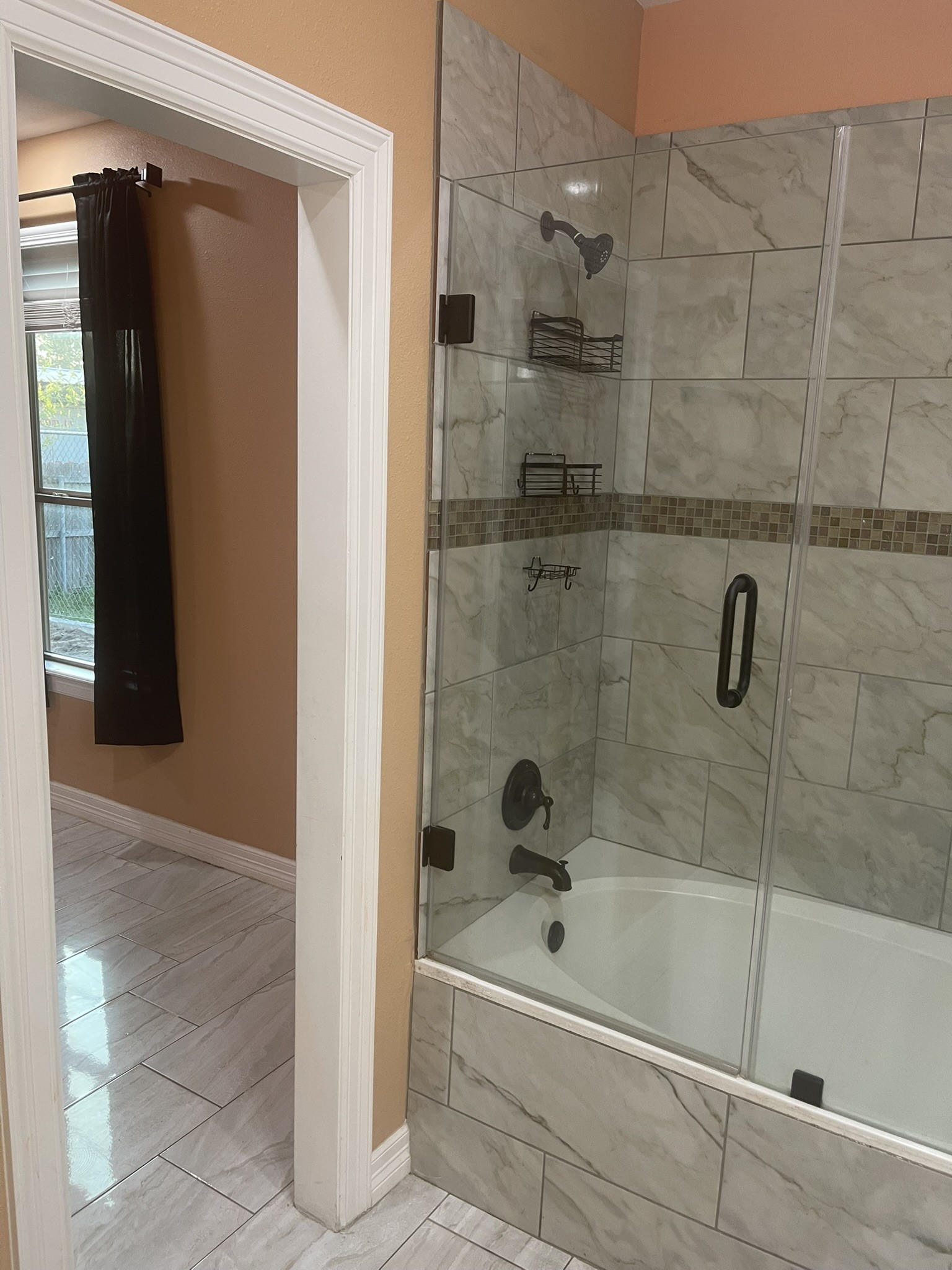 5829 Hartwick Road Houston, TX 77016 - Photo 39 of 47 a bathroom with a shower and a bath tub