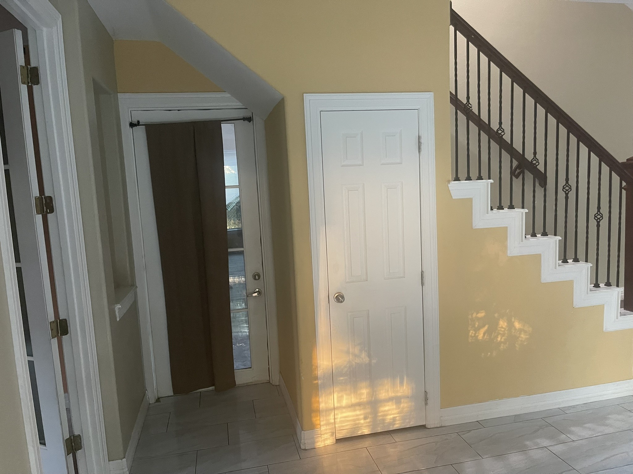 5829 Hartwick Road Houston, TX 77016 - Photo 46 of 47 a view of staircase with wooden floor and door