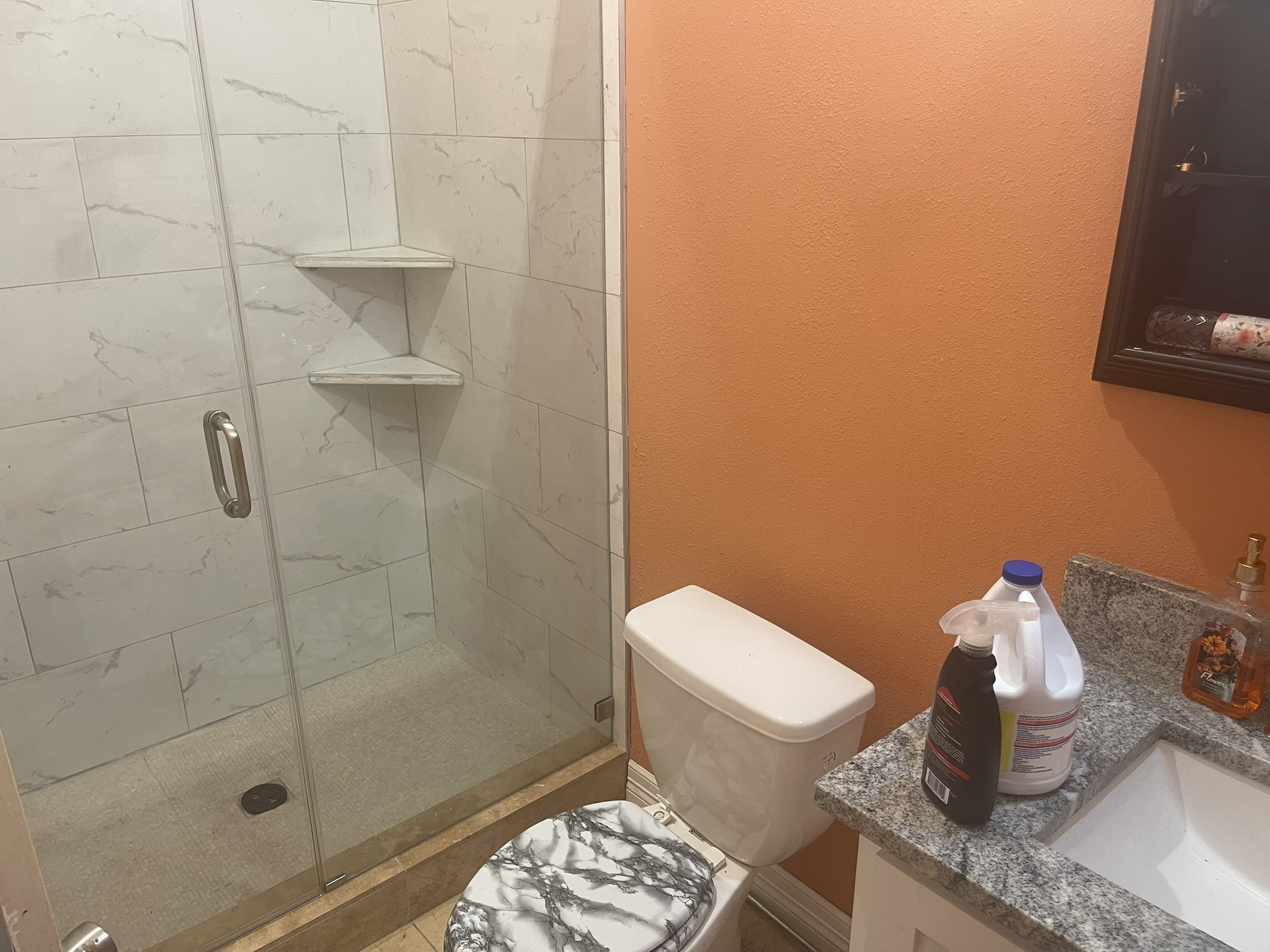 5829 Hartwick Road Houston, TX 77016 - Photo 47 of 47 a bathroom with a granite countertop toilet and a shower