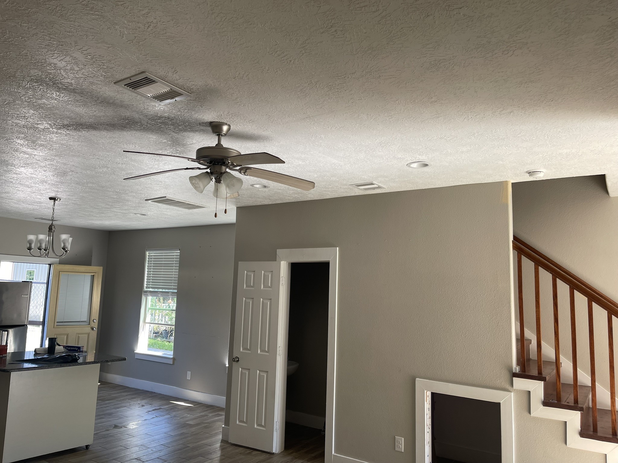 5829 Hartwick Road Houston, TX 77016 - Photo 7 of 47 a view of empty room with wooden floor and fan