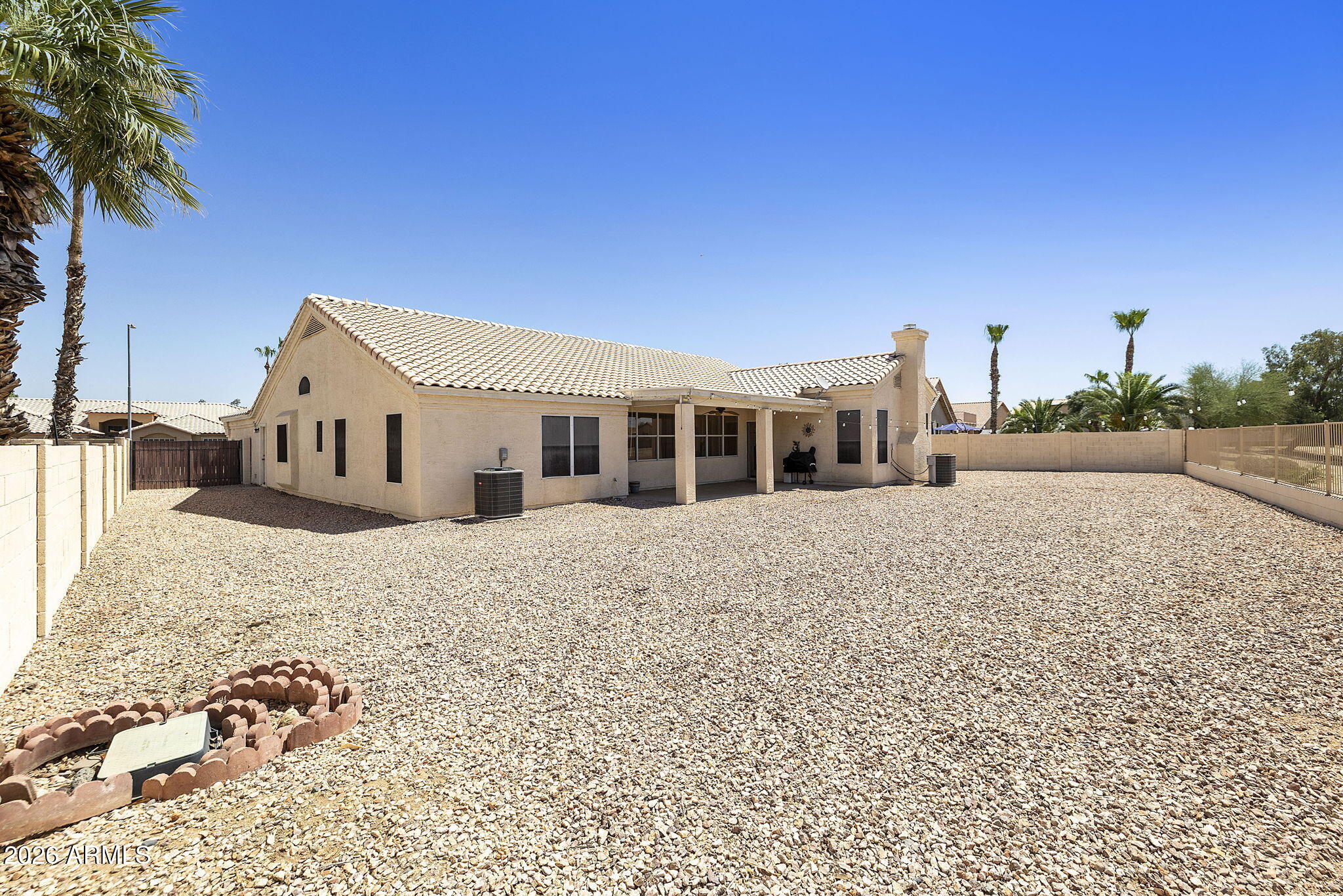 12435 West Monte Vista Road Avondale, AZ 85392 - Photo 51 of 69 a front view of a house with a yard