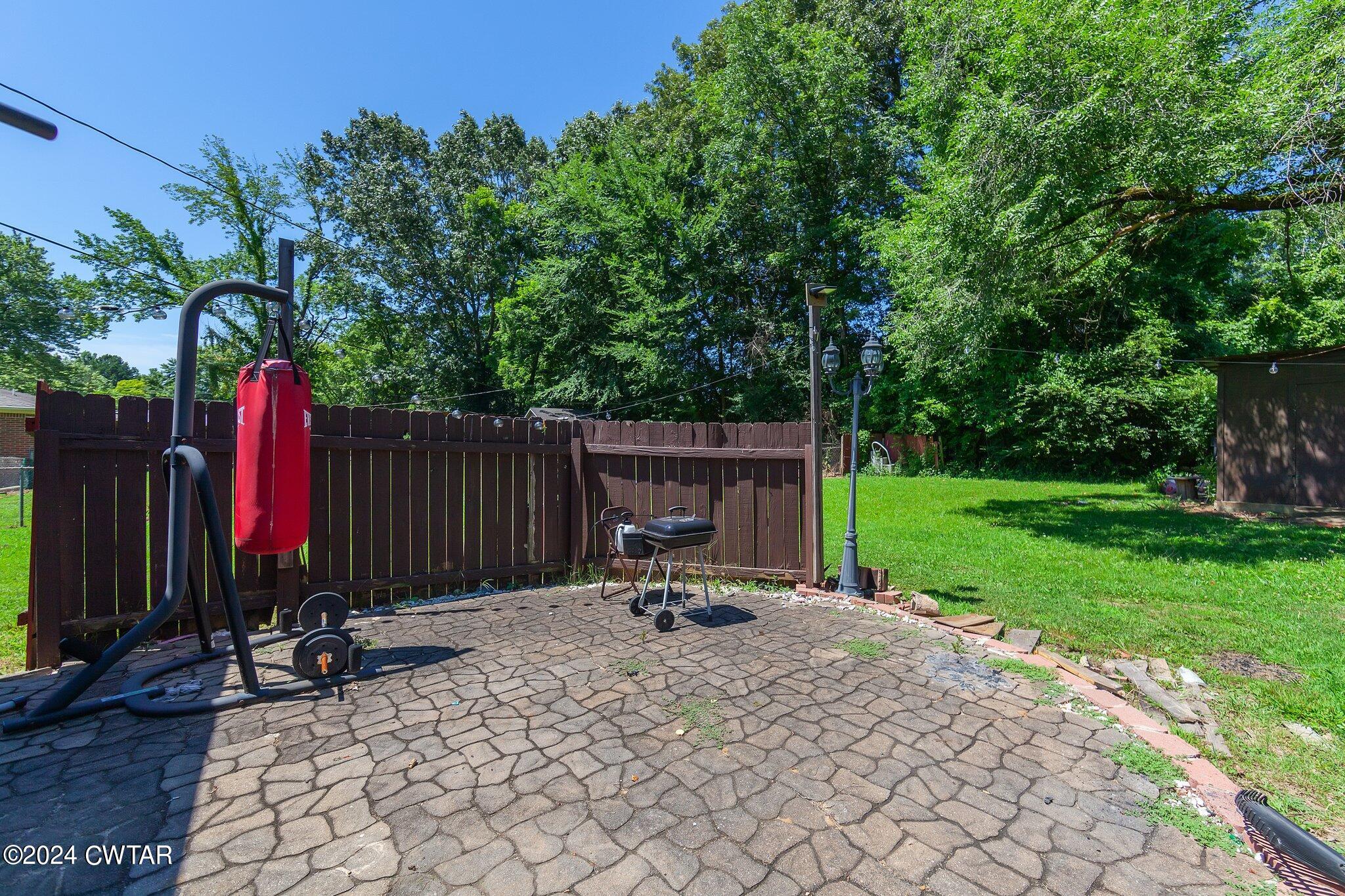 119 Robertson Avenue Camden, TN 38320 - Photo 10 of 28 a view of garden with patio