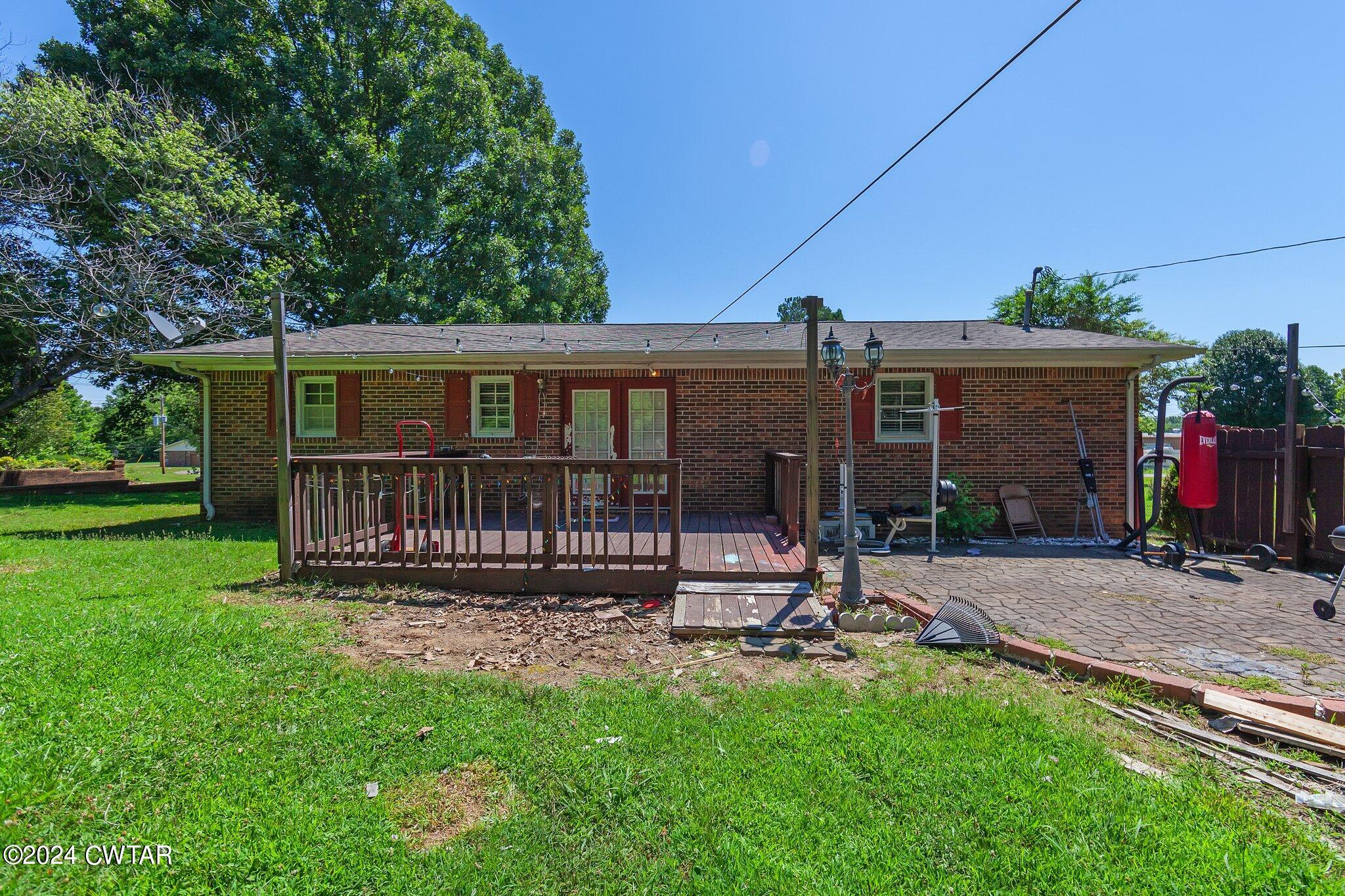 119 Robertson Avenue Camden, TN 38320 - Photo 12 of 28 front view of a house with a yard