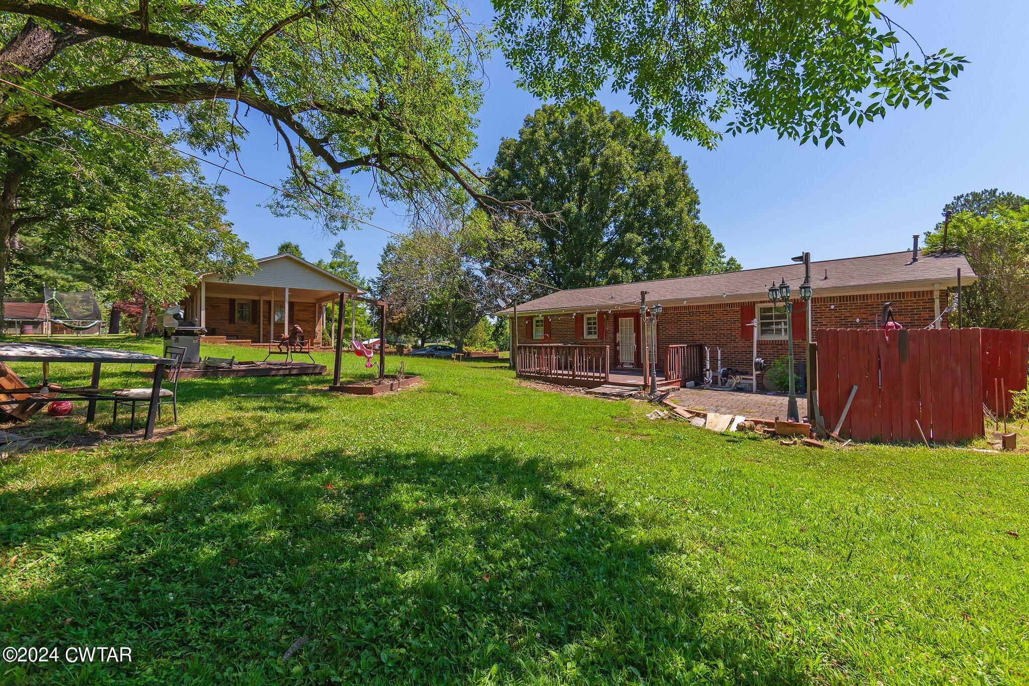 119 Robertson Avenue Camden, TN 38320 - Photo 13 of 28 a house view with a sitting space and garden