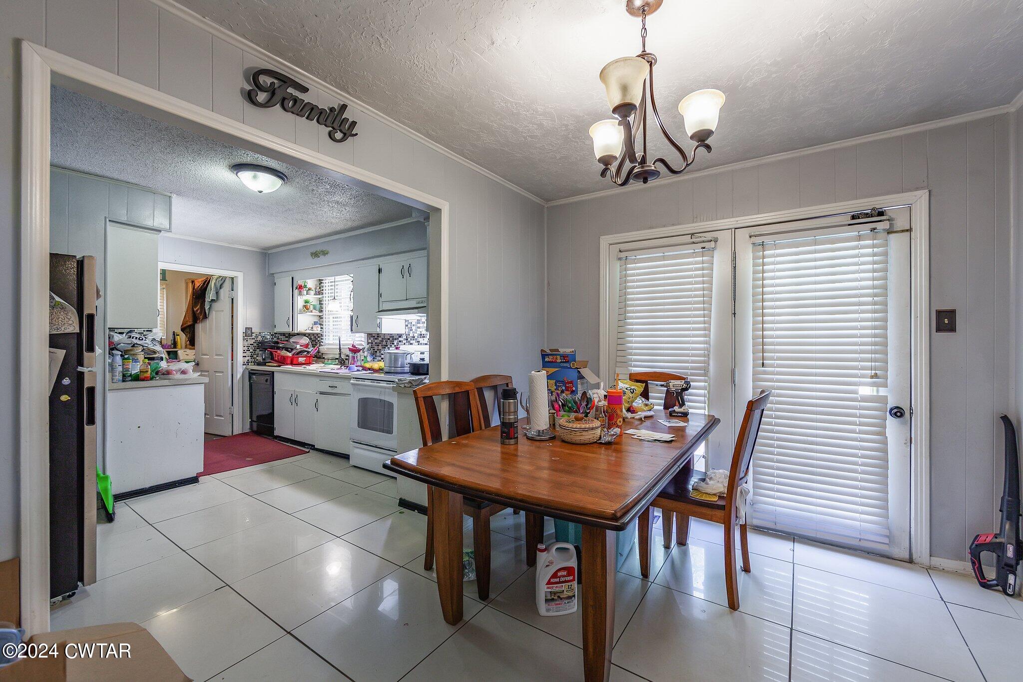 119 Robertson Avenue Camden, TN 38320 - Photo 19 of 28 a view of a dining room with furniture and window
