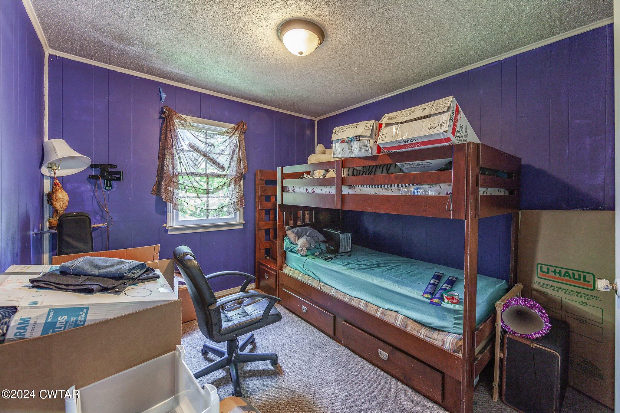 119 Robertson Avenue Camden, TN 38320 - Photo 27 of 28 a bedroom with furniture and a window