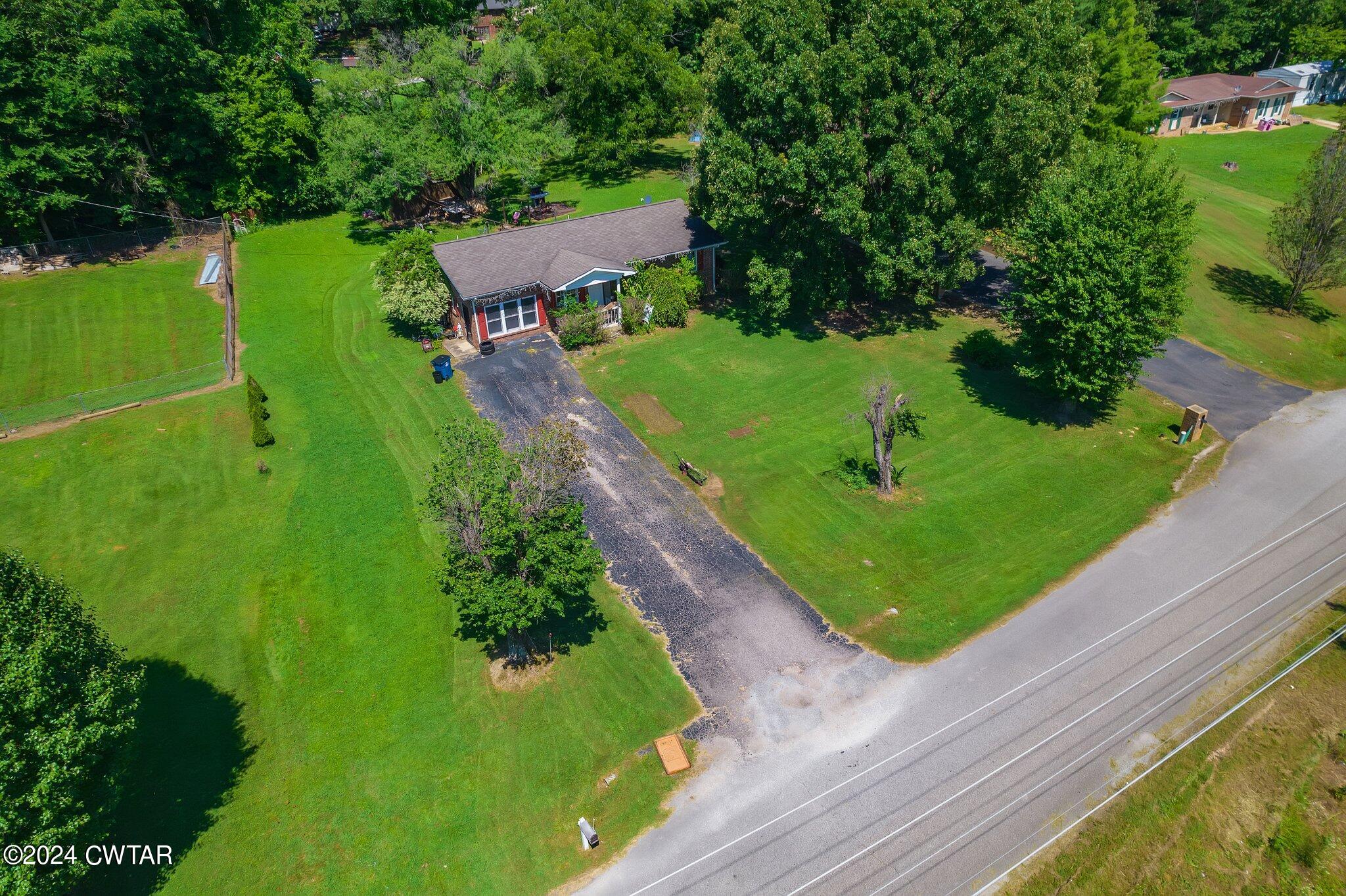 119 Robertson Avenue Camden, TN 38320 - Photo 2 of 28 a view of a garden with a lake view