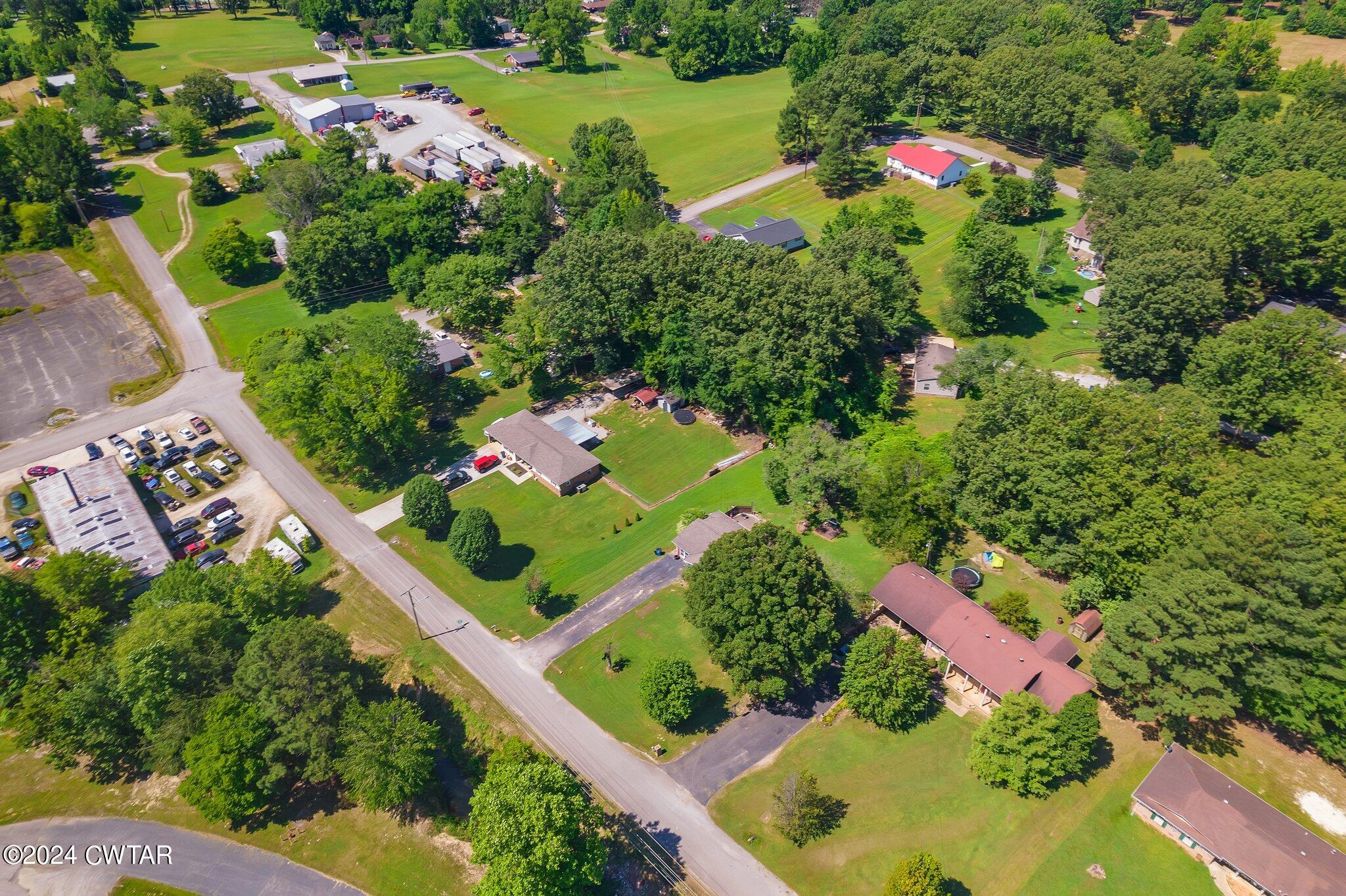 119 Robertson Avenue Camden, TN 38320 - Photo 4 of 28 a view of a garden with a lot of flower plants