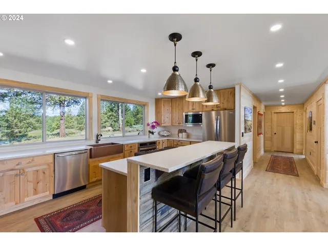 a bedroom with a large bed and a large window