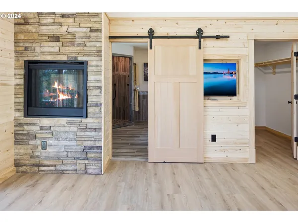 a bathroom with a tub sink and mirror