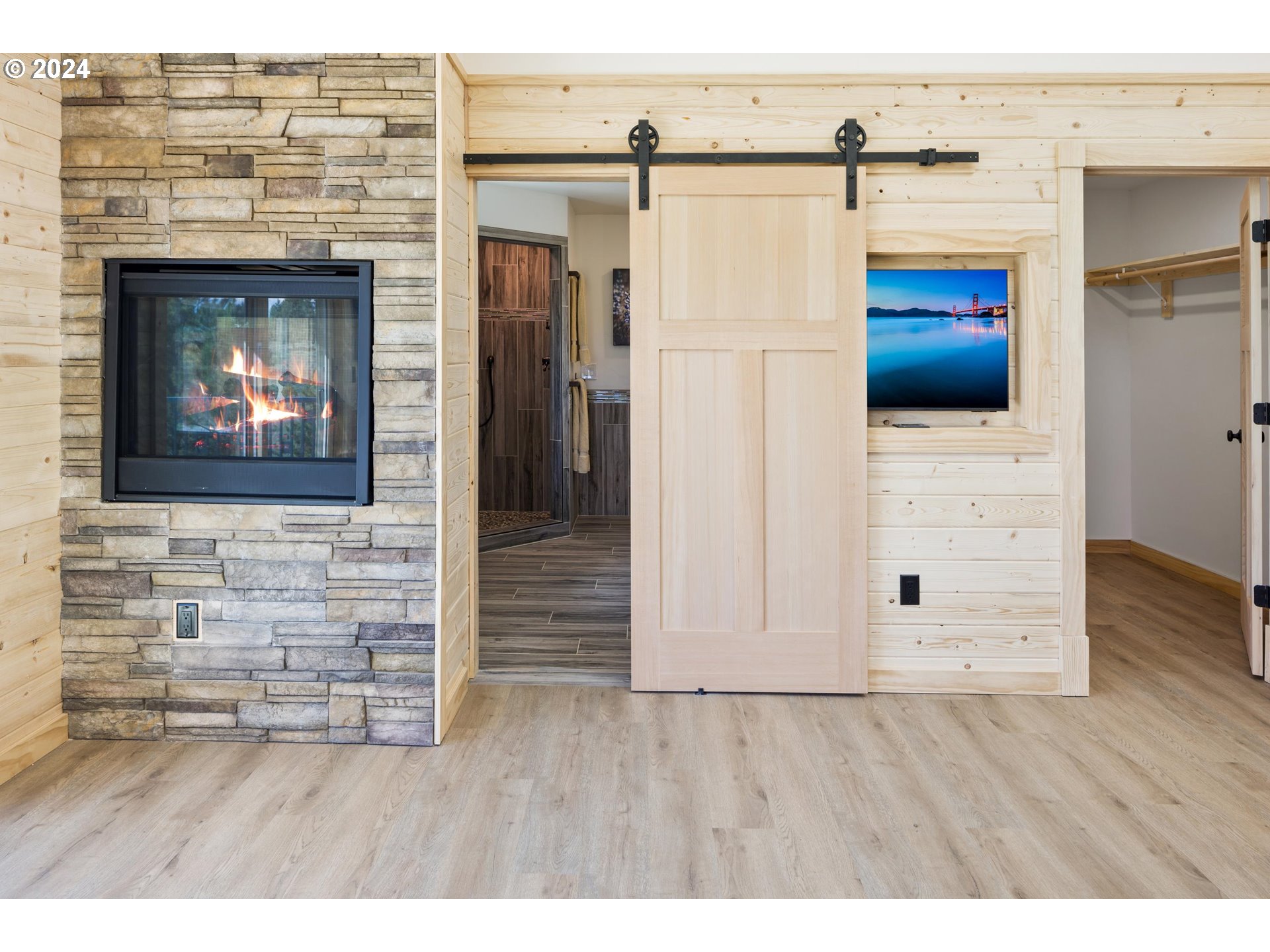 45371 Hackmore Drive Seneca, OR 97873 - Photo 17 of 37 a view of an empty room with wooden floor and a fireplace
