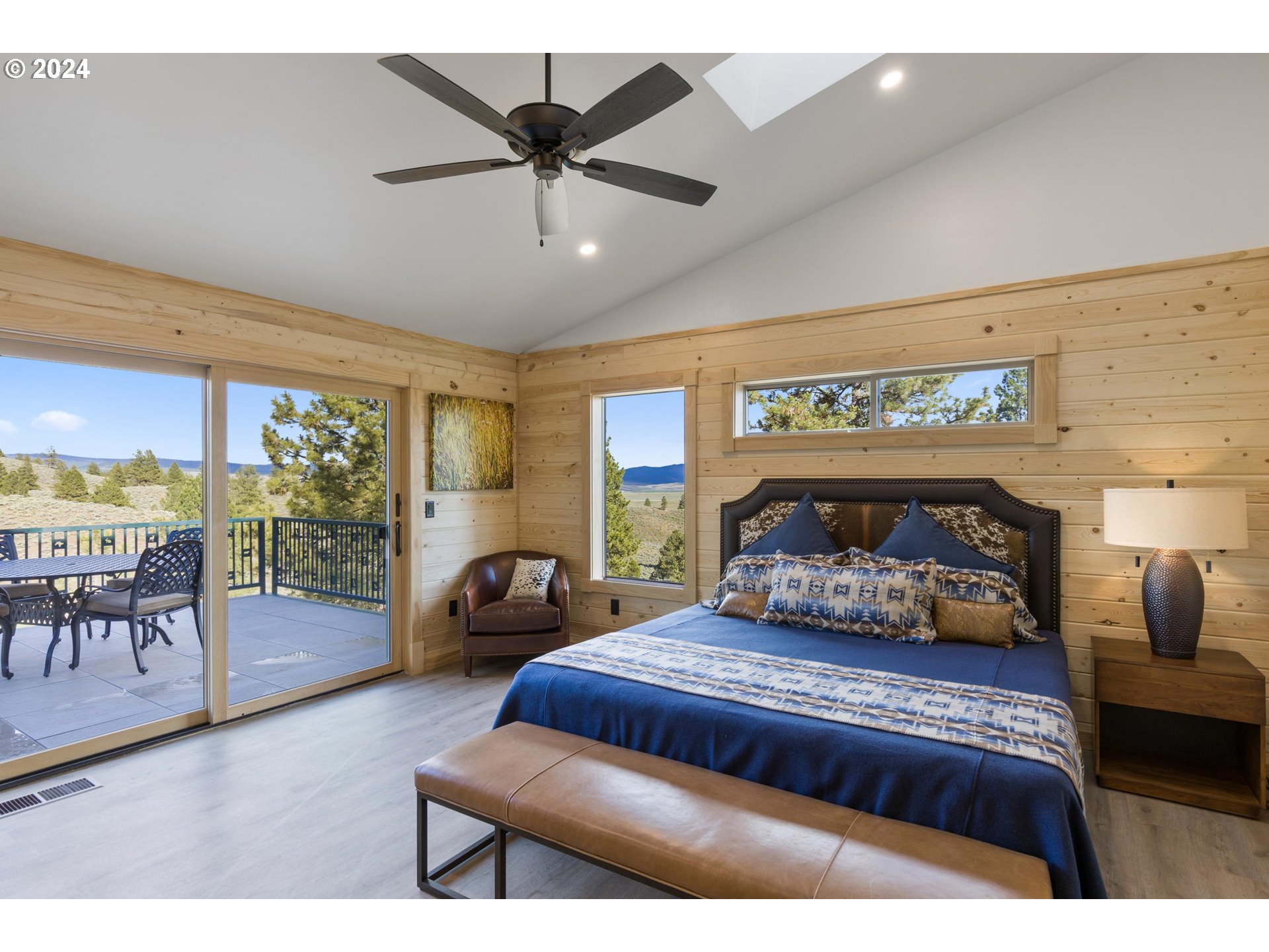 45371 Hackmore Drive Seneca, OR 97873 - Photo 20 of 37 a bedroom with a bed a large window and furniture