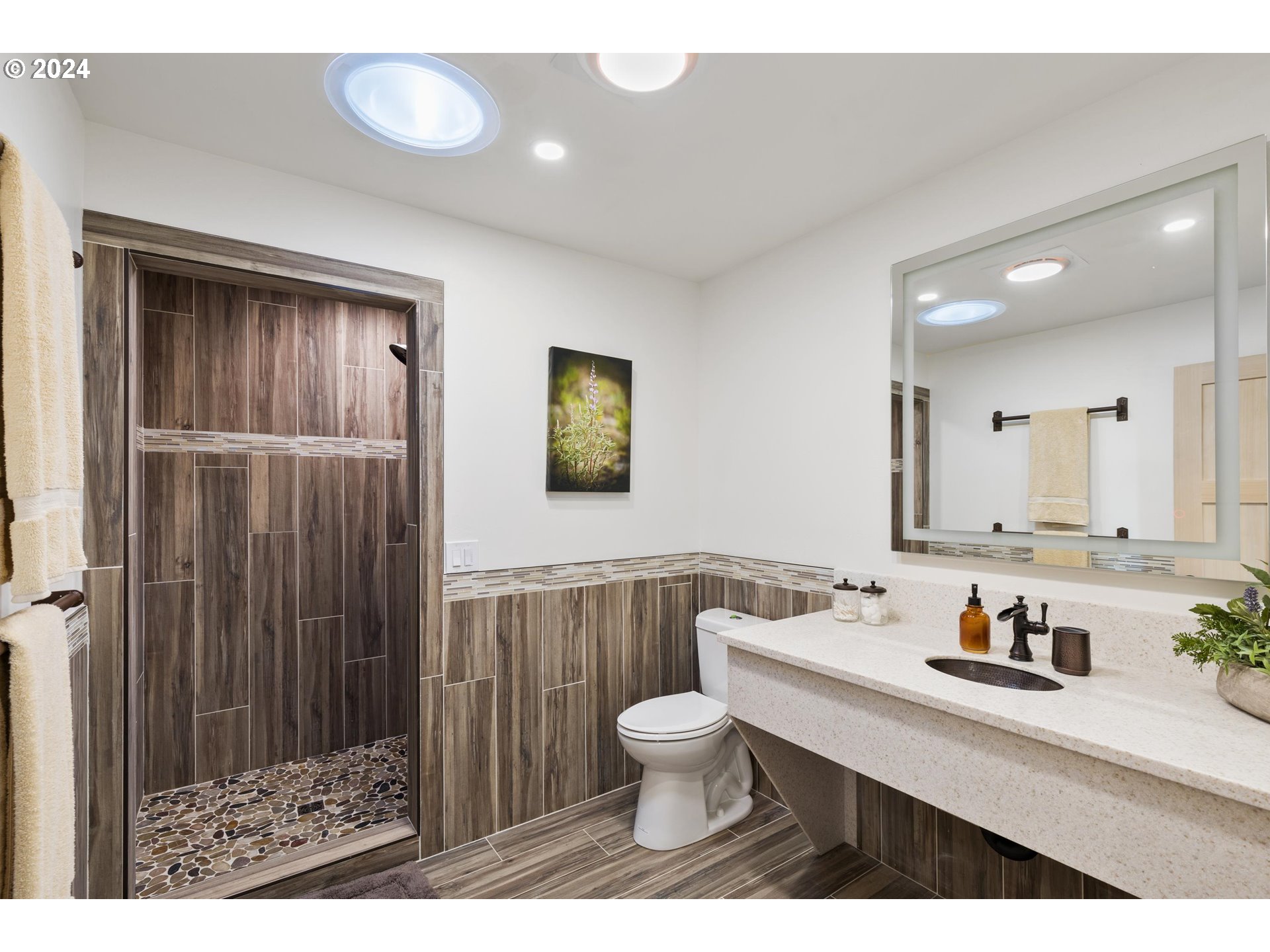 45371 Hackmore Drive Seneca, OR 97873 - Photo 25 of 37 a bathroom with a sink a toilet a mirror and shower