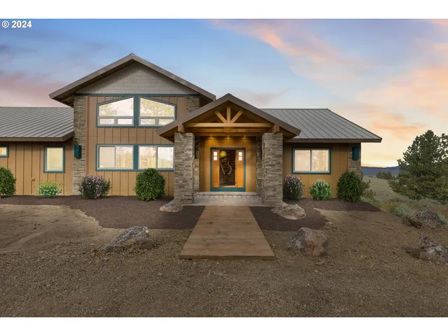 a living room with furniture a air conditioner and a window
