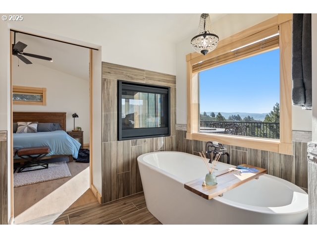 45371 Hackmore Drive Seneca, OR 97873 - Photo 37 of 37 a bathroom with a tub sink and mirror