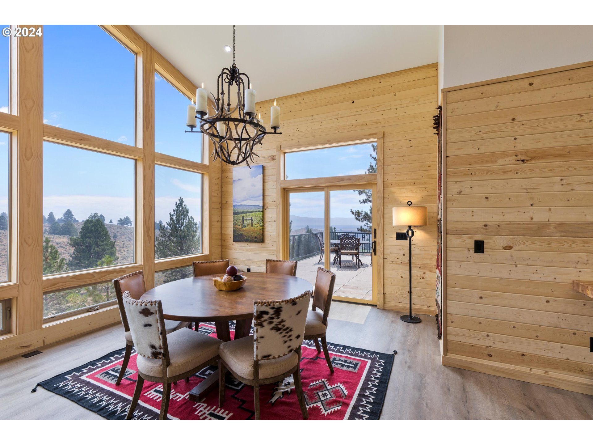 45371 Hackmore Drive Seneca, OR 97873 - Photo 10 of 37 a dining room with furniture a chandelier and wooden floor