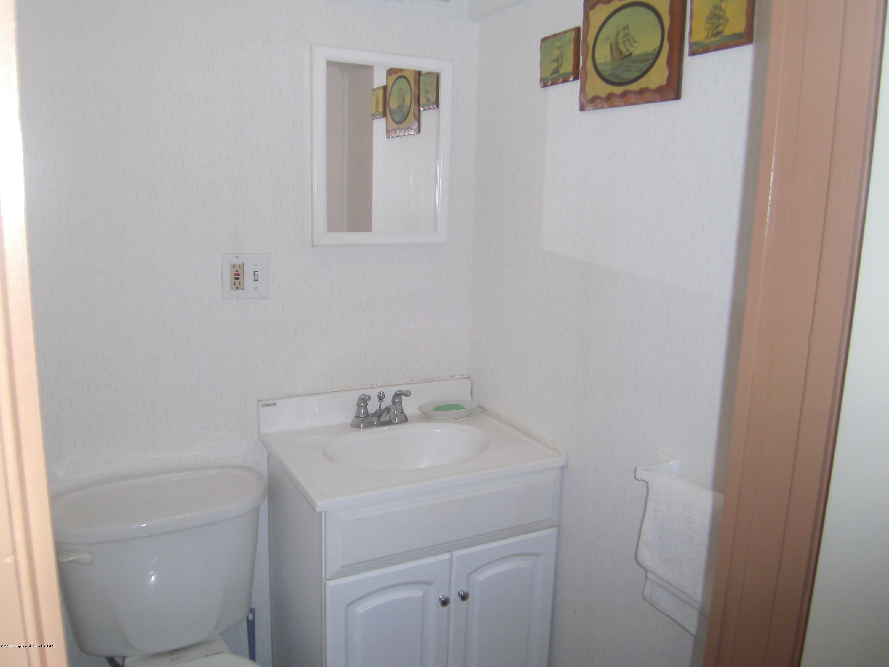 855 Becks Crossing Road Moscow, PA 18444 - Photo 17 of 43 a bathroom with a sink and vanity