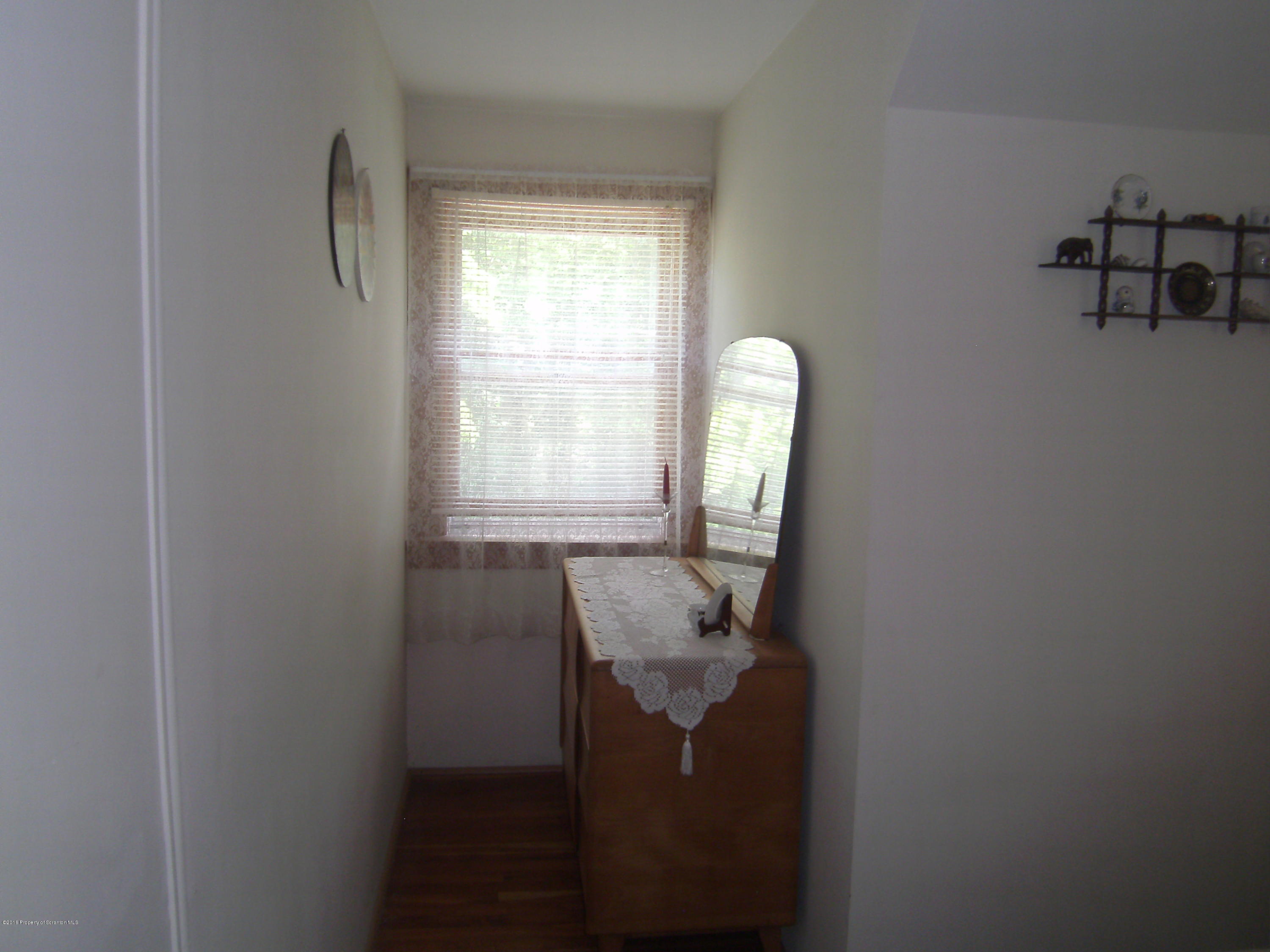 855 Becks Crossing Road Moscow, PA 18444 - Photo 20 of 43 a room with furniture and a window