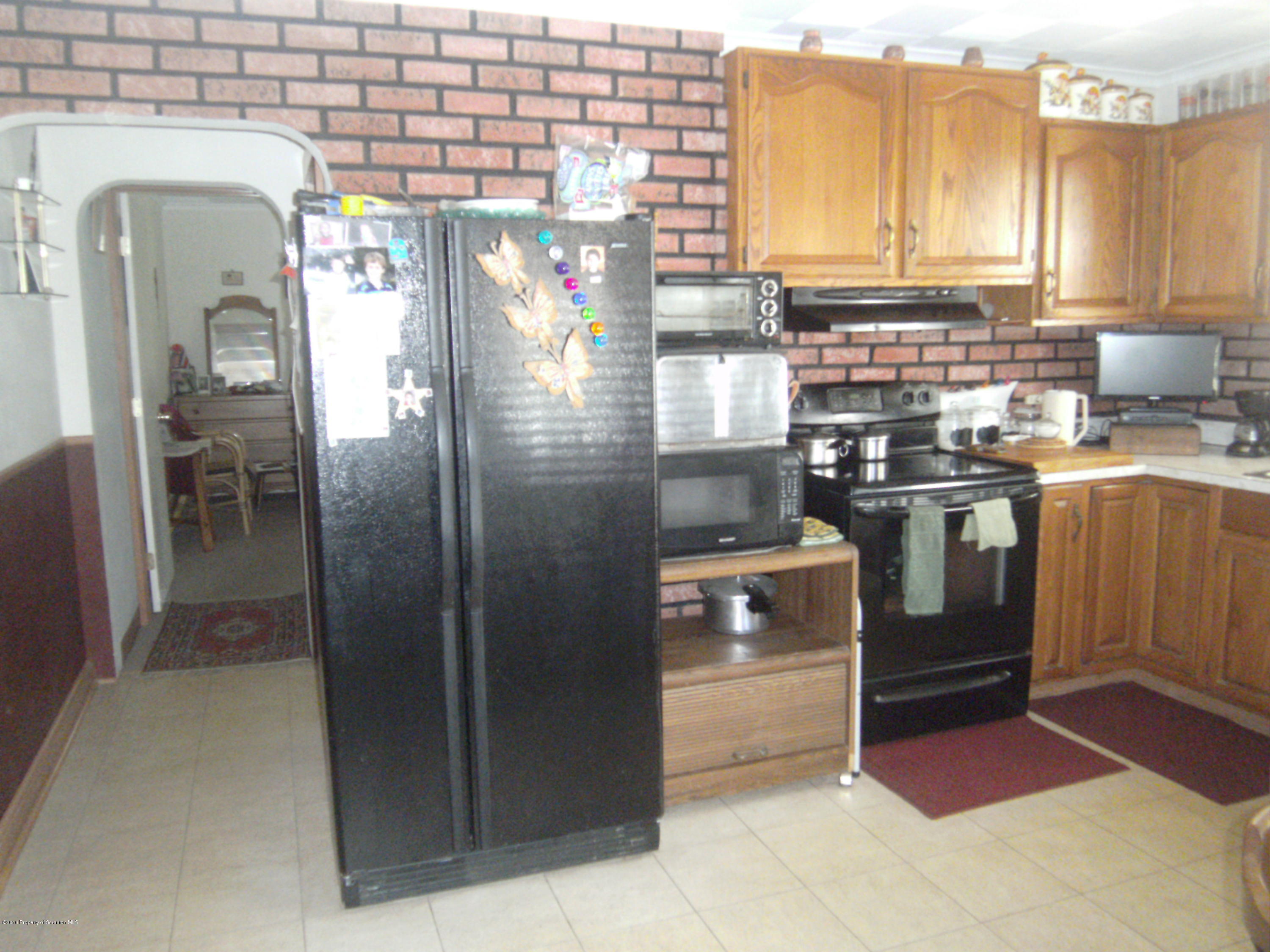 855 Becks Crossing Road Moscow, PA 18444 - Photo 2 of 43 a kitchen with stainless steel appliances granite countertop a refrigerator a stove and a sink