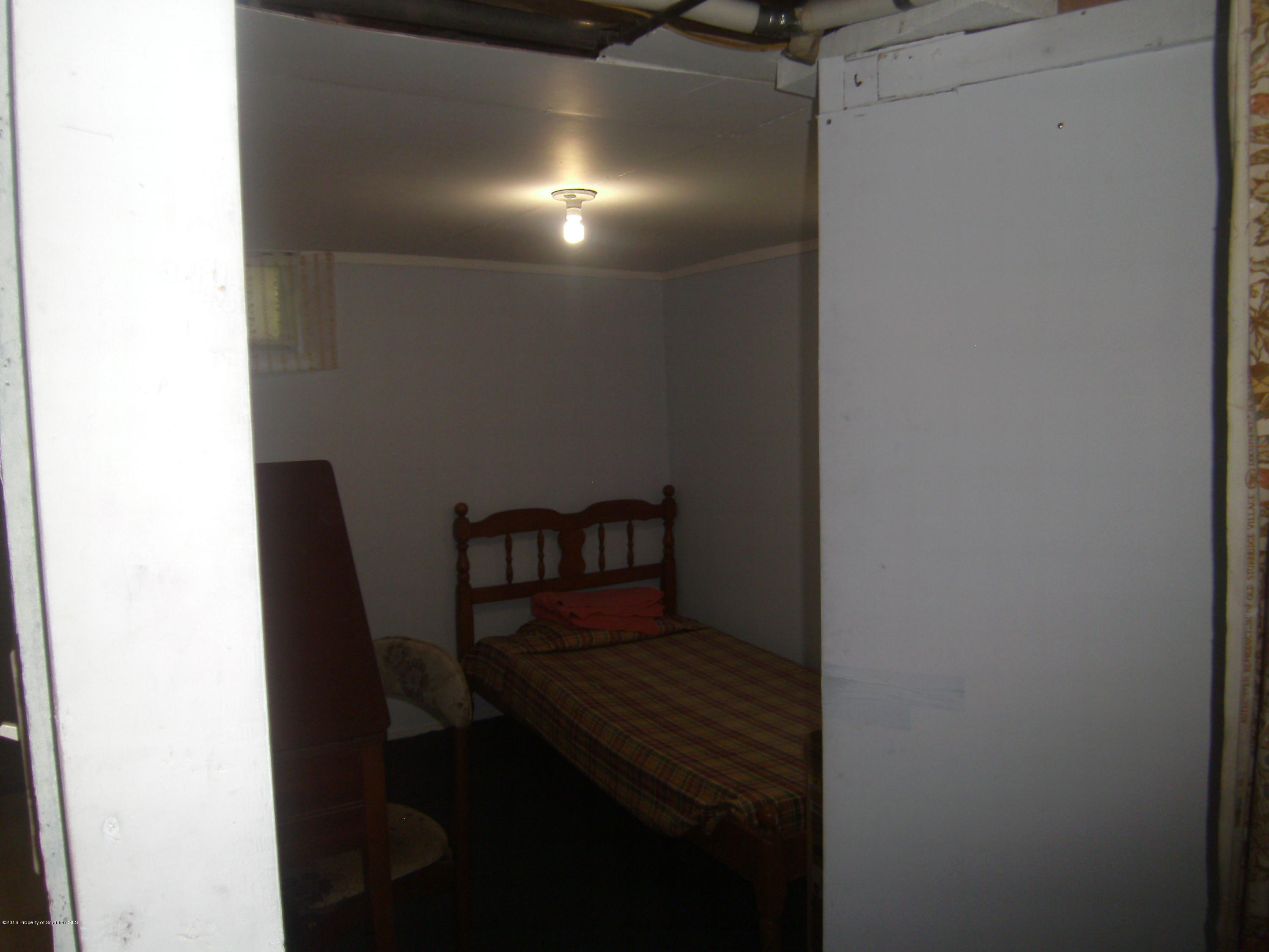 855 Becks Crossing Road Moscow, PA 18444 - Photo 24 of 43 a view of a hallway with wooden floor and staircase