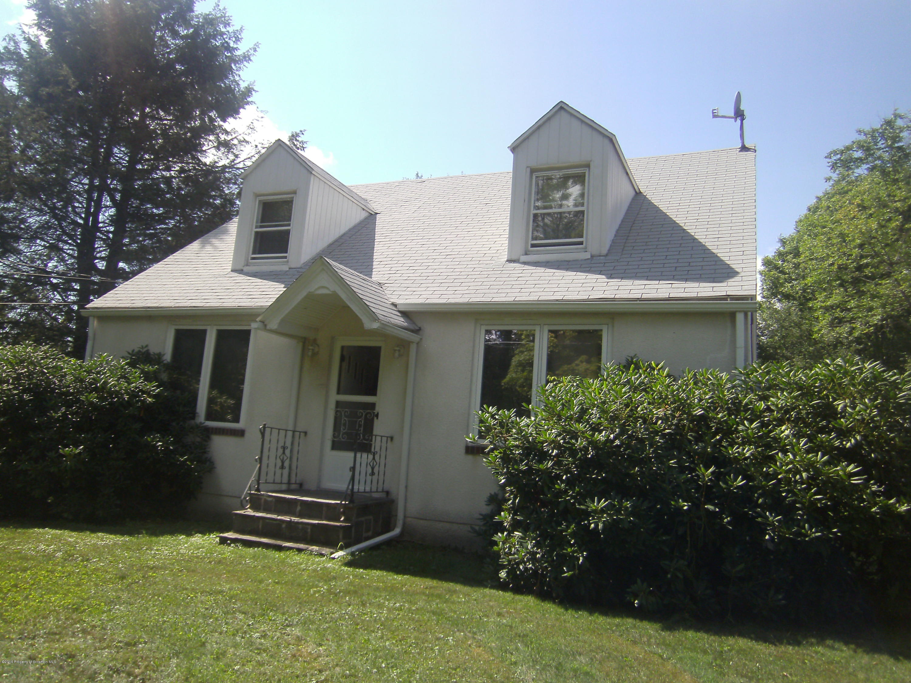 855 Becks Crossing Road Moscow, PA 18444 - Photo 31 of 43 a front view of a house with garden