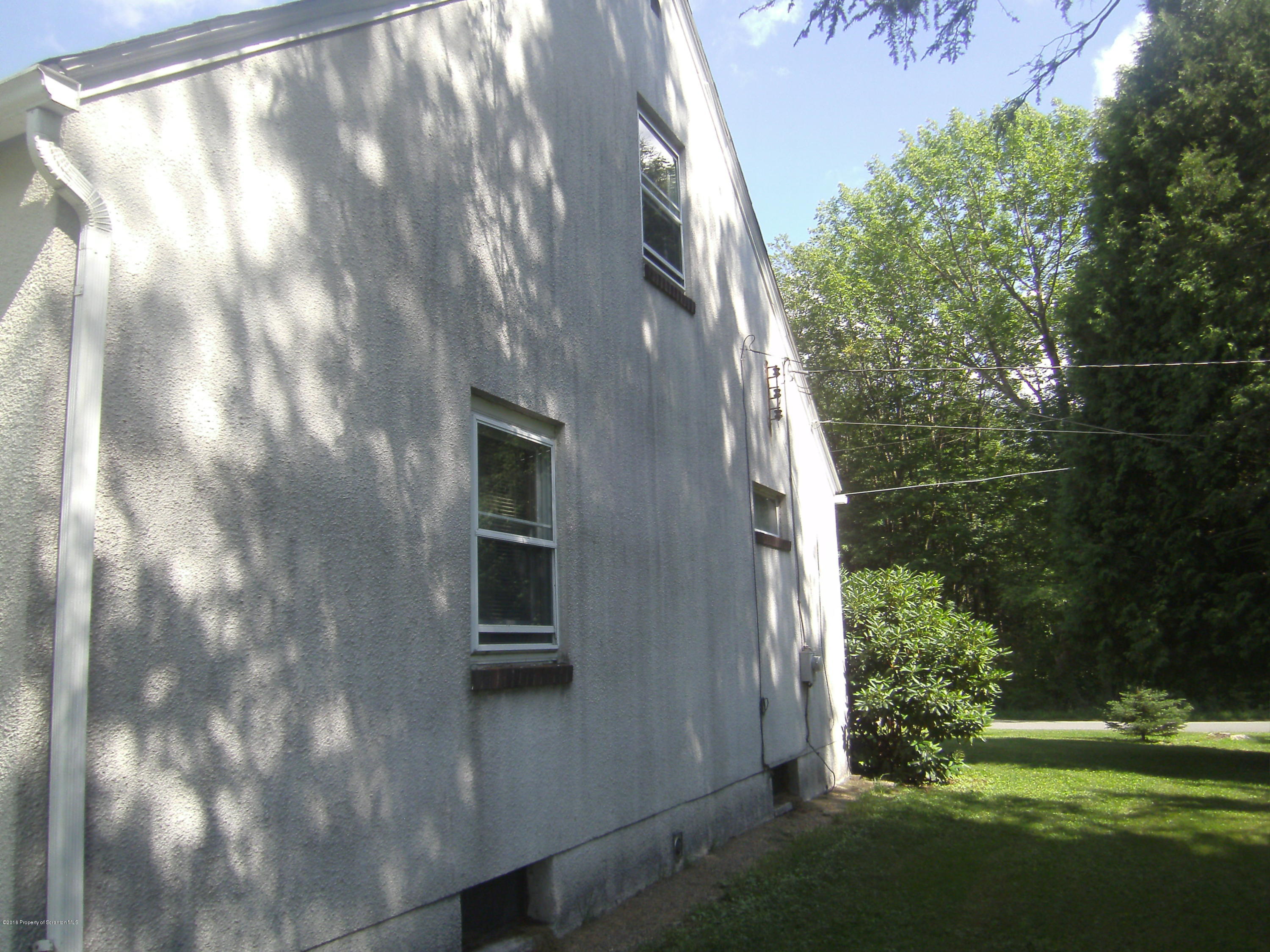 855 Becks Crossing Road Moscow, PA 18444 - Photo 38 of 43 a view of a house with a yard