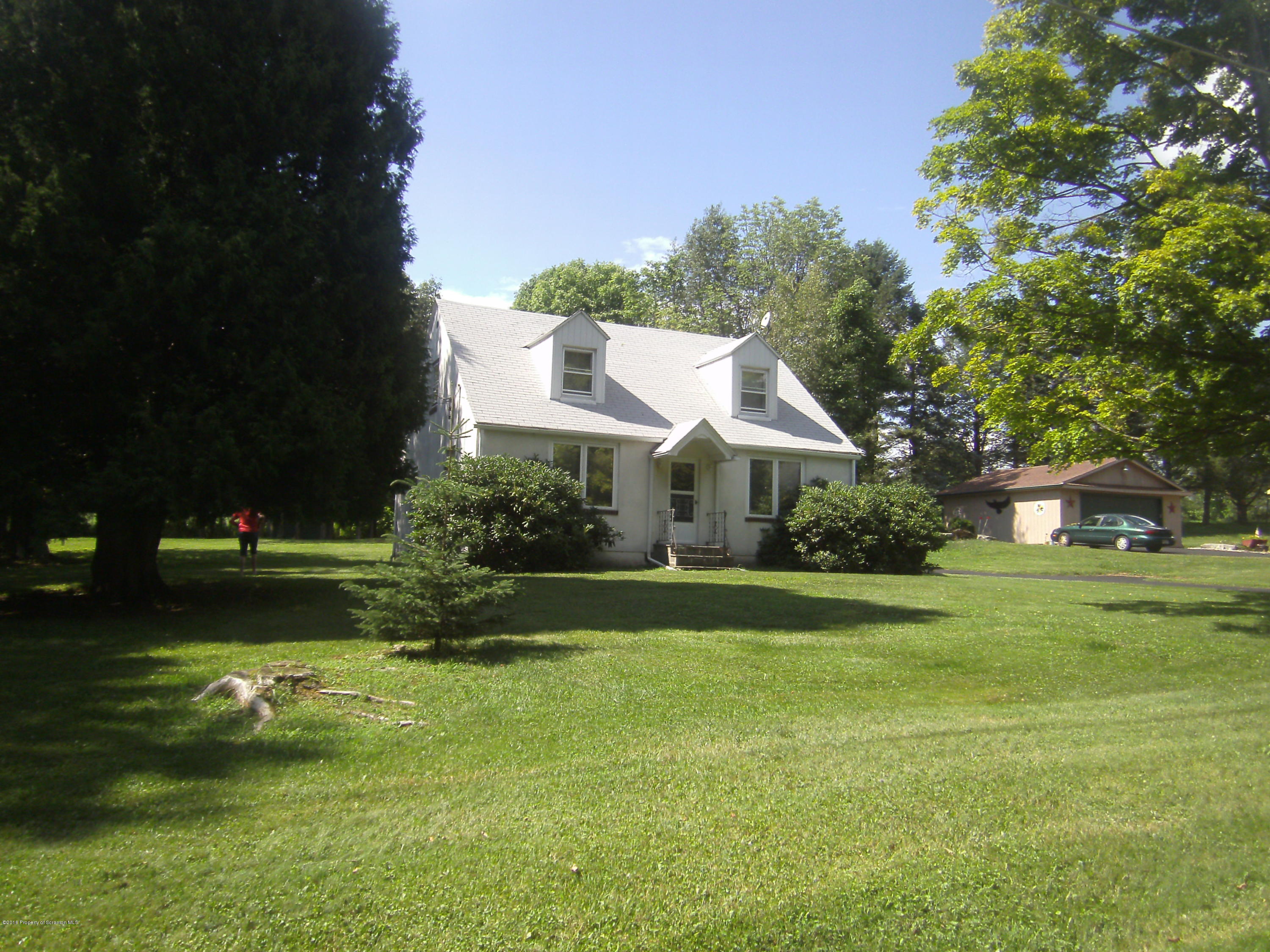 855 Becks Crossing Road Moscow, PA 18444 - Photo 40 of 43 a front view of a house with garden